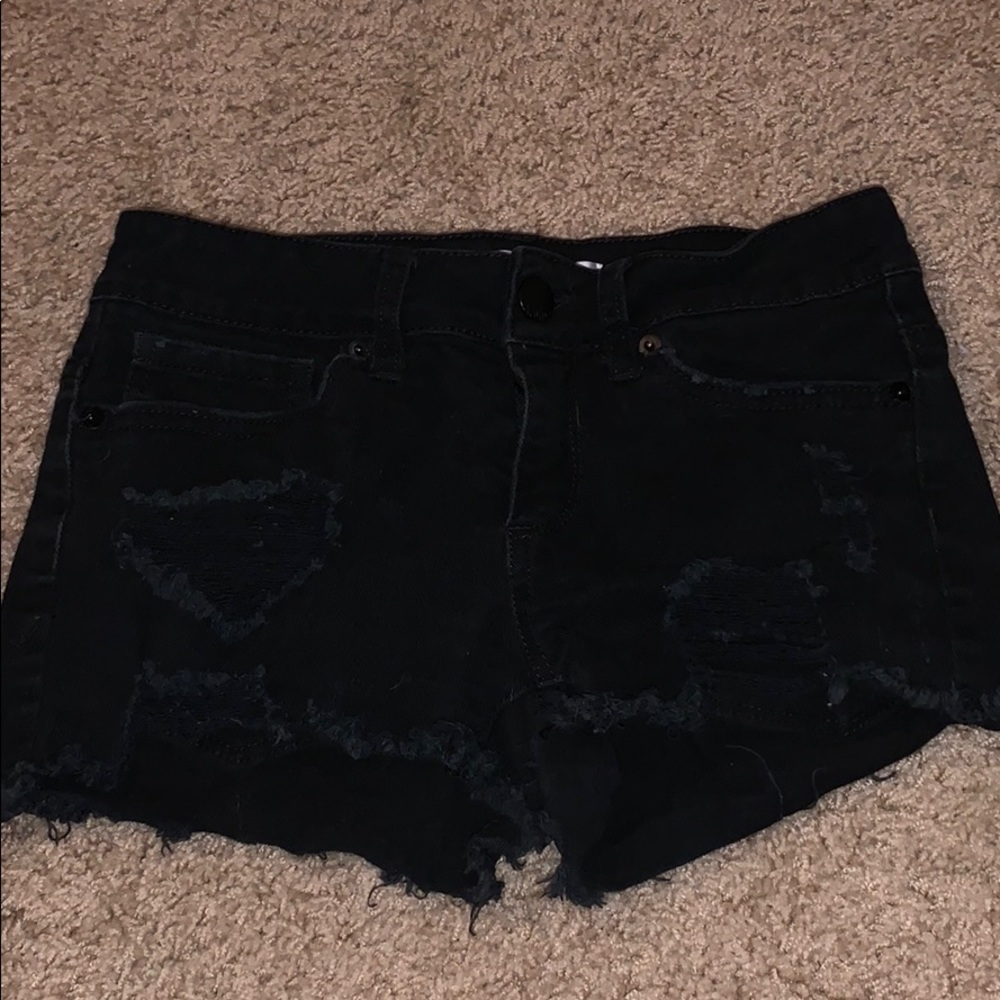 black ripped jean shorts